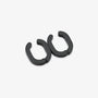 A pair of matte black split C-shaped hoop earrings on a clean, light gray background.