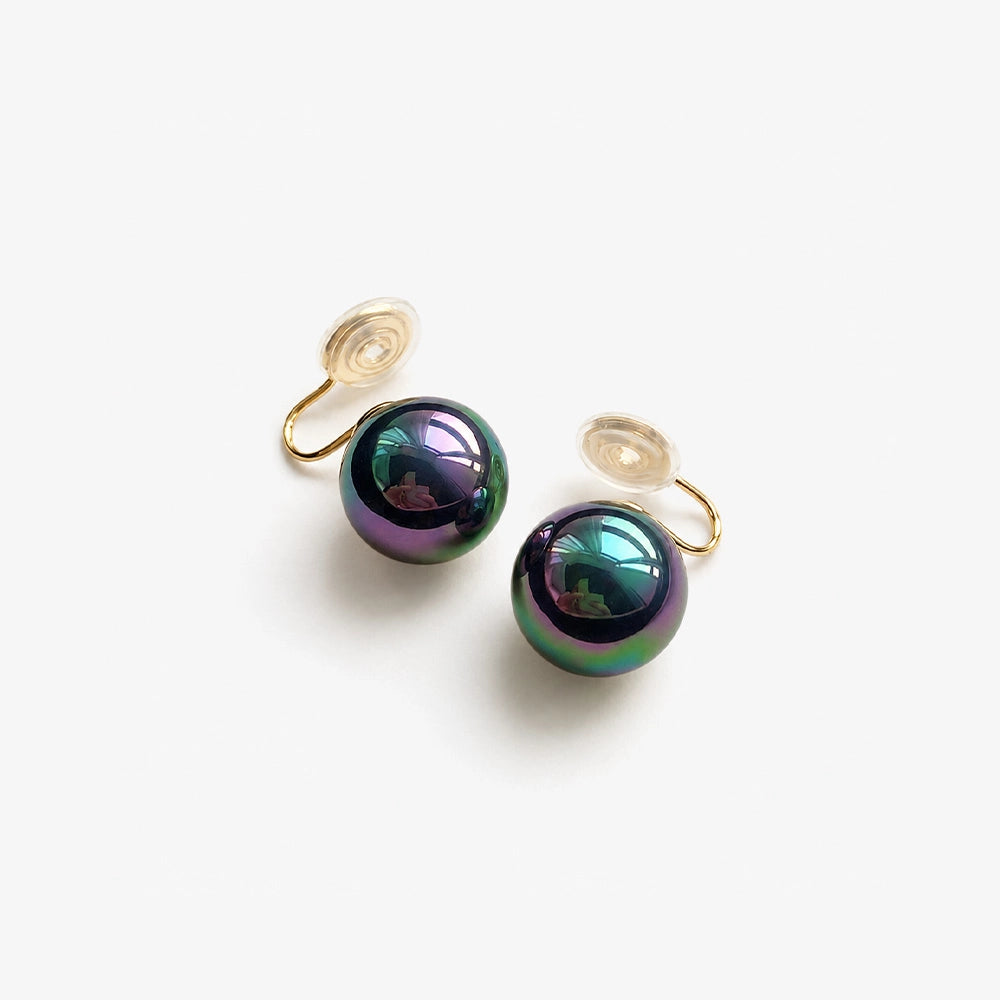 Black pearl clip on earrings with iridescent finish and gold spiral hooks displayed on white background