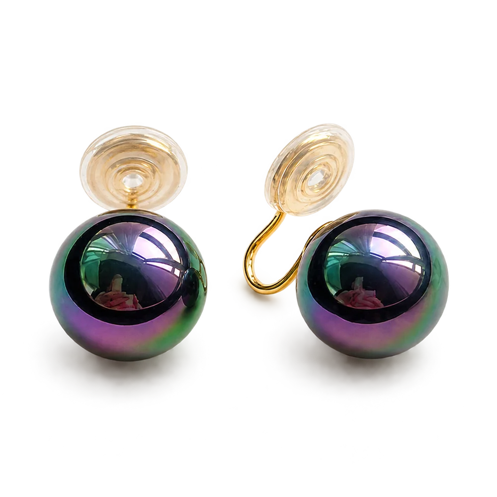 Pair of Black Pearl Clip-On Earrings displayed on a soft white surface, capturing the classic and timeless design.