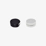 Black and silver magnetic round stud earrings mixed pair displayed side by side on white background