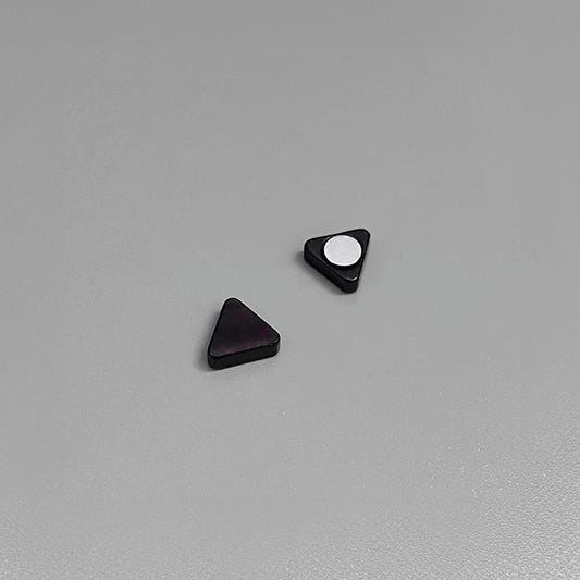 The deep black finish enhances the geometric design, offering a modern twist on classic earrings. 