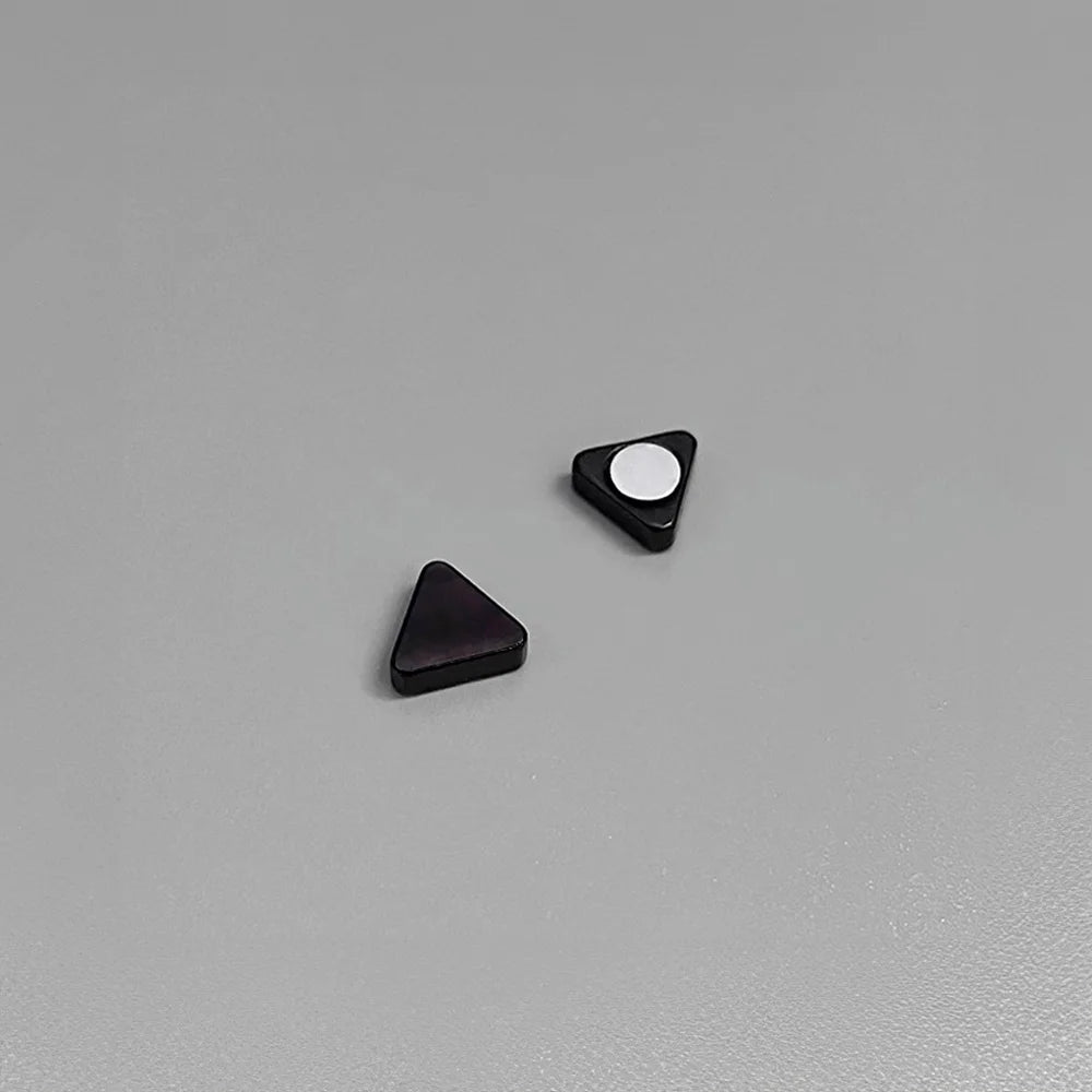 Black triangle magnetic stud earrings displayed on white surface, showing front and back angles