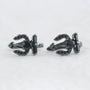 Black Trident Clip-On Ear Cuff pair displayed front view on white background, gunmetal finish
