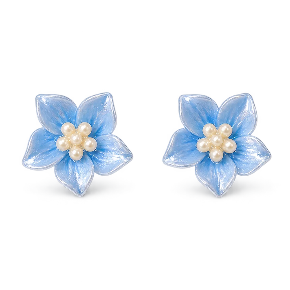 A pair of light blue flower-shaped stud magnetic earrings with white faux pearl centers, shown on a clean white background.