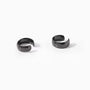 Bold black conch ear cuffs pair displayed at angle on white background showing glossy finish