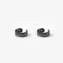 Bold black conch ear cuffs front view on white background, polished curved design