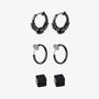 A set of black clip-on earrings in various designs, including hoop earrings and magnetic ear studs, displayed against a white background.