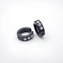 Black zirconia bold clip-on hoop earrings with crystal stones, angled view on white background
