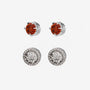 Pair of silver earrings with red ruby and clear gemstones on a white background