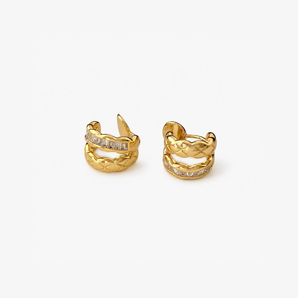 Gold braided baguette clip-on earrings front view on white background with packaging