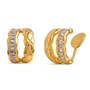 A pair of gold huggie hoop earrings with a channel-set row of clear baguette-cut stones, shown from both front and side angles on a white background.