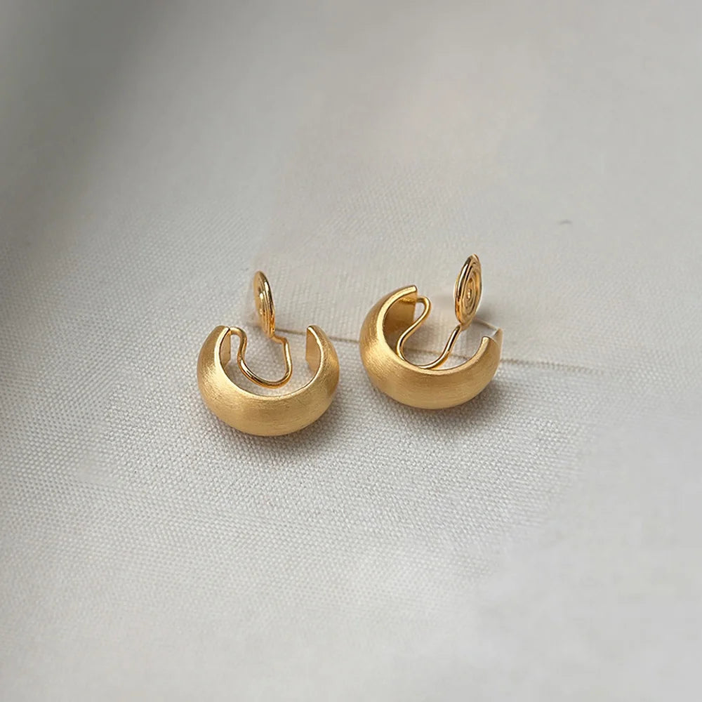 Gold clip on hoop earrings with a luxurious brushed texture and U-type clip-on design