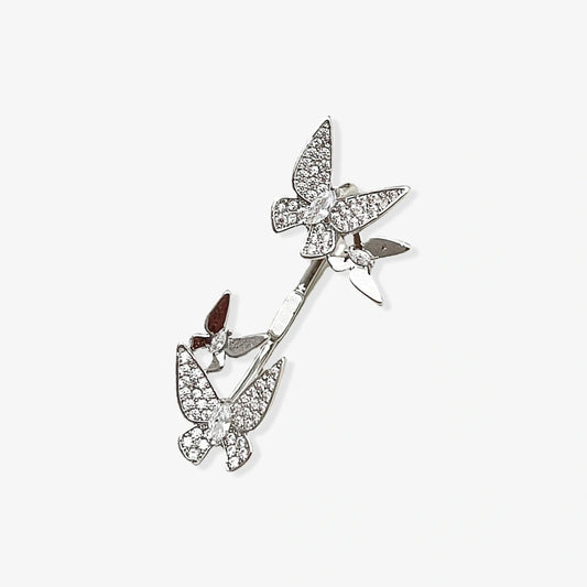 Close-up of the Butterfly Glimmer Ear Cuff showcasing intricate micro-paved zirconia stones on a white gold plated butterfly design.