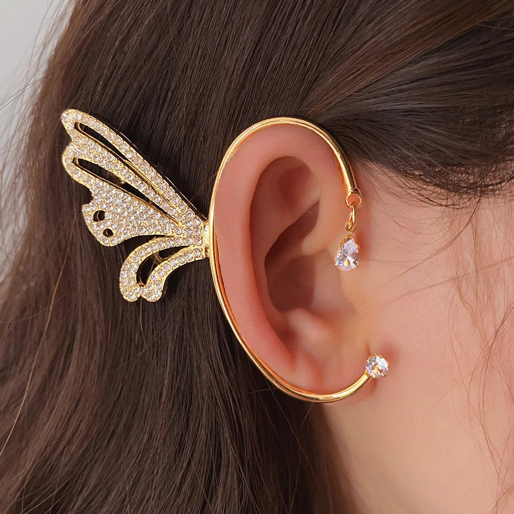 Butterfly Wing Ear Cuff in White Gold displayed on ear with crystal studs, side view angle