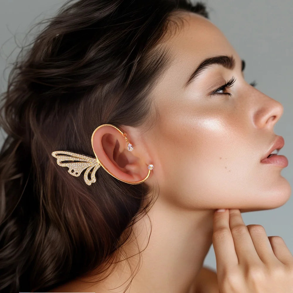 Model wearing the Butterfly Wing Ear Cuff in Gold, highlighting the elegant wrap-around design and secure fit on the ear.