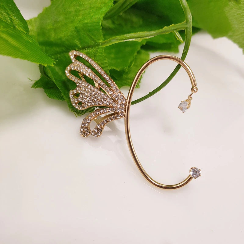 Close-up of the Butterfly Wing Ear Cuff in Gold, showcasing the intricate butterfly wing design adorned with shimmering zircon stones.