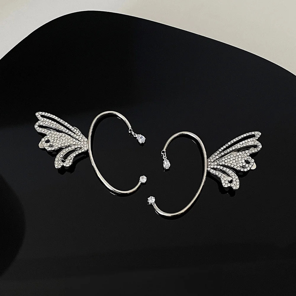 Butterfly Wing Ear Cuff in White Gold with crystal detailing, front view on black background