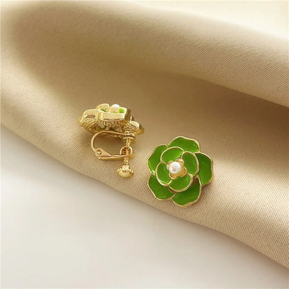 Elegant gold-plated copper alloy women's clip earrings with screw-back clip-on design, shown in green.