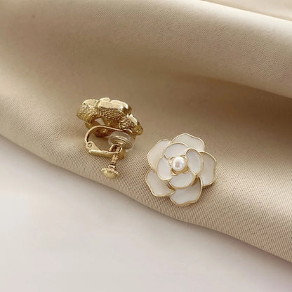 Timeless gold-plated copper alloy women's clip earrings with screw-back clip-on design, shown in white.