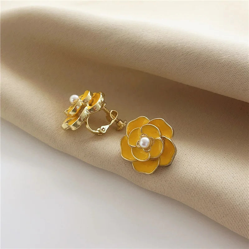 Cheerful gold-plated copper alloy women's clip earrings with screw-back clip-on design, shown in yellow.