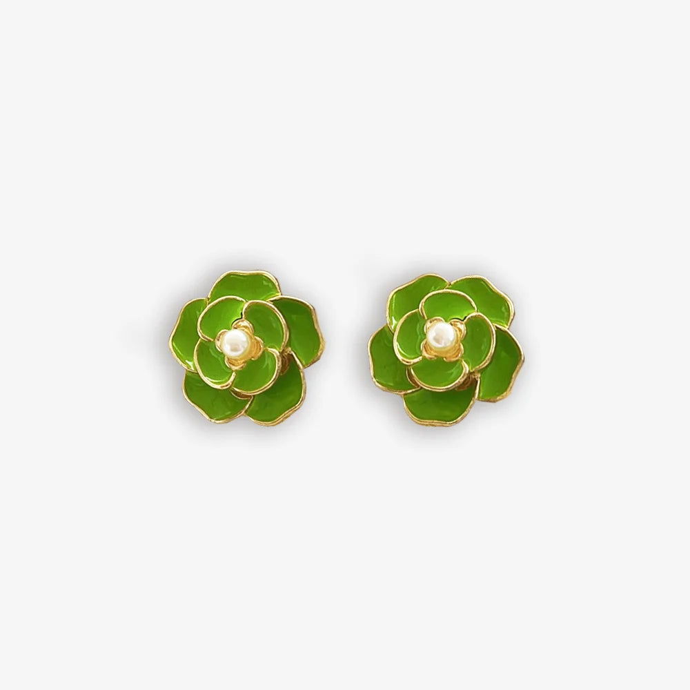 Fresh green enamel clip on earrings for women with a pearl center and flower design.