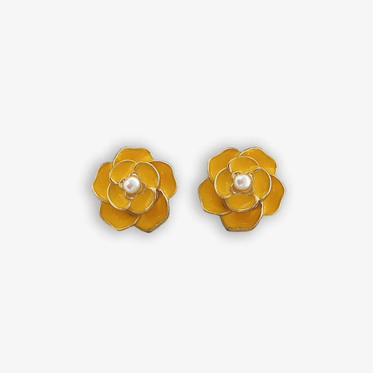 Bright yellow enamel clip on earrings for women with a pearl center and flower design.