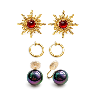 Celestial Glow Trio Clip-On Earring Set featuring gold hoops, sun motifs with red stones, and iridescent spheres on white background