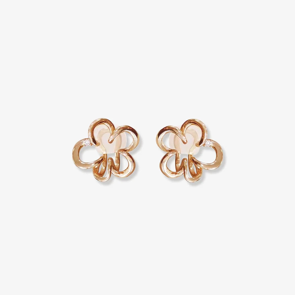 Rose gold cherry blossom floral ear cuffs displayed front view on white background