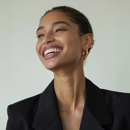 Model wearing Chunky Curved Gold Clip-On Earring