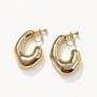A pair of chunky, organic-shaped gold hoop earrings with a glossy, fluid texture and screw-back closures, displayed on a clean white background.
