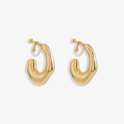 Chunky Curved Hoop Screw Back Clip On Earrings in polished gold alloy make a bold statement. 