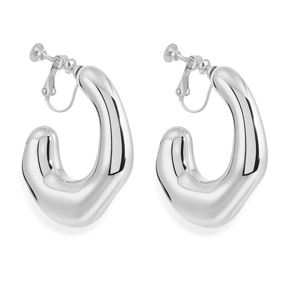 A pair of chunky, polished silver hoop earrings with a unique organic, wavy silhouette and screw-back clasp, shown on a clean white background.