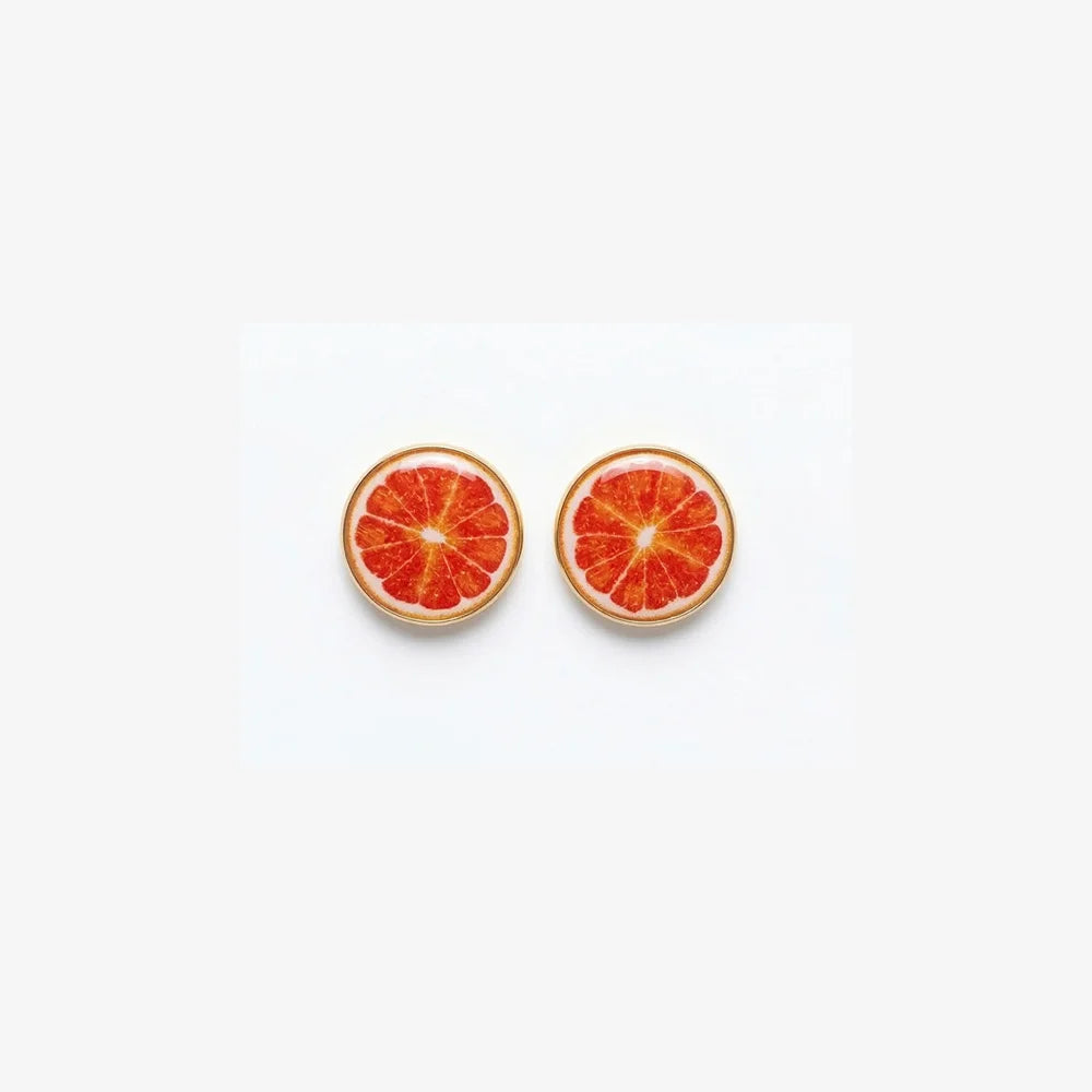 A pair of no-piercing Zesty Grapefruit Magnetic Stud Earrings, showcasing their detailed resin fruit slice design, isolated on a white background.