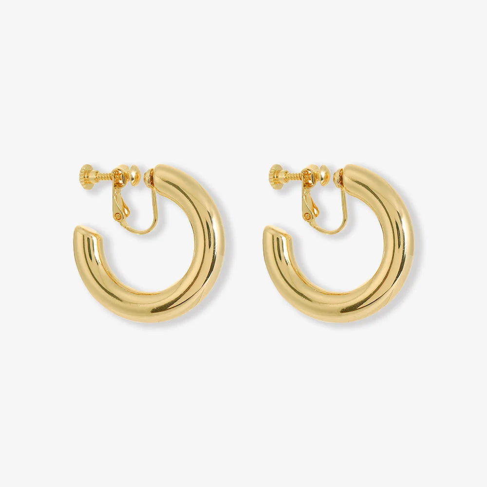 Gold classic hoop clip on earrings displayed front view on white background showing polished finish and screw back closure