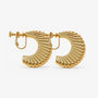 Gold hoop earrings with a textured design on a white background