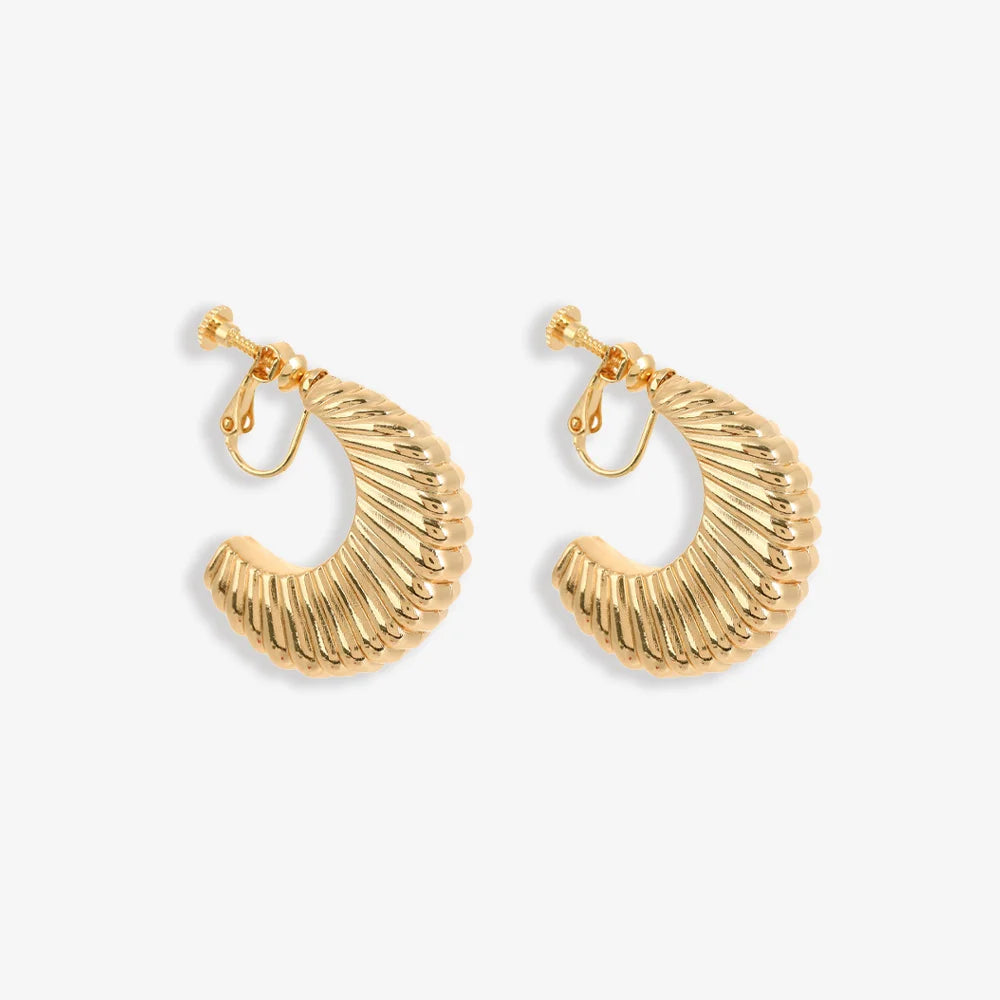 Gold croissant semi hoop clip-on earrings front view on white background, textured finish