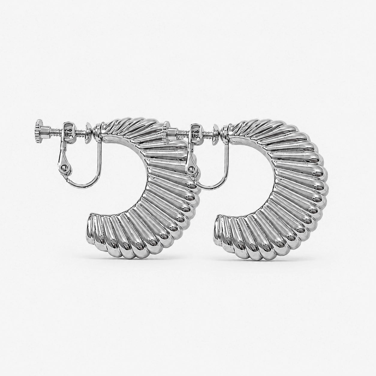 Silver croissant semi hoop clip on earrings front view on white background