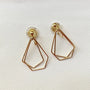 Dainty layered geometric clip-on earrings in gold and rose gold tones displayed on white background