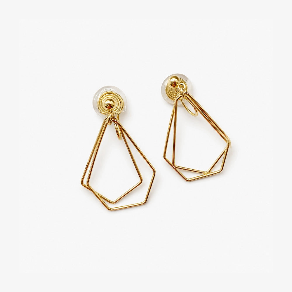Dainty layered geometric clip-on earrings in gold tone displayed on white background