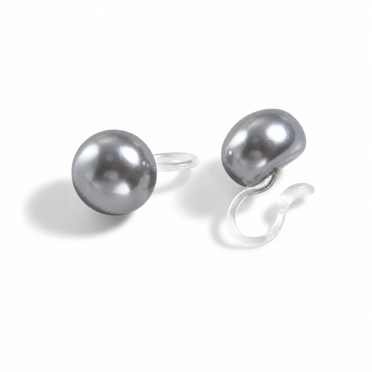 Pair of grey pearl stud earrings on a white background