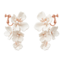 A pair of dangling floral earrings with white flower petals and small pearl-like beads, set in rose gold-tone metal, shown on a plain white background.
