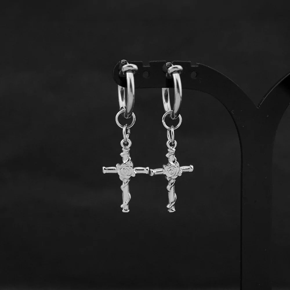 Showcase of Divine Rose Cross Clip-On Earrings with rose detail.