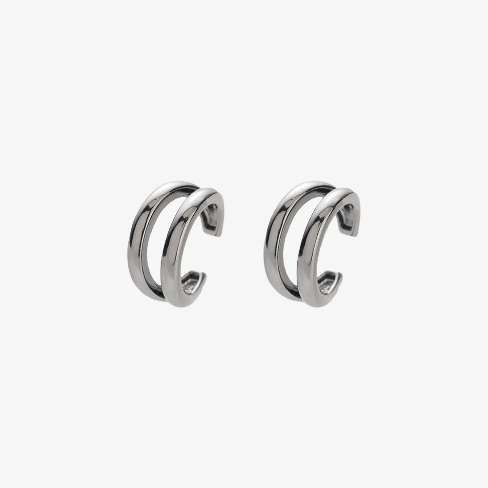 Silver double-band minimalist clip-on ear cuffs displayed front view on white background
