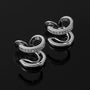 Silver double hoop clip-on earrings with crystal details, angled view on black background
