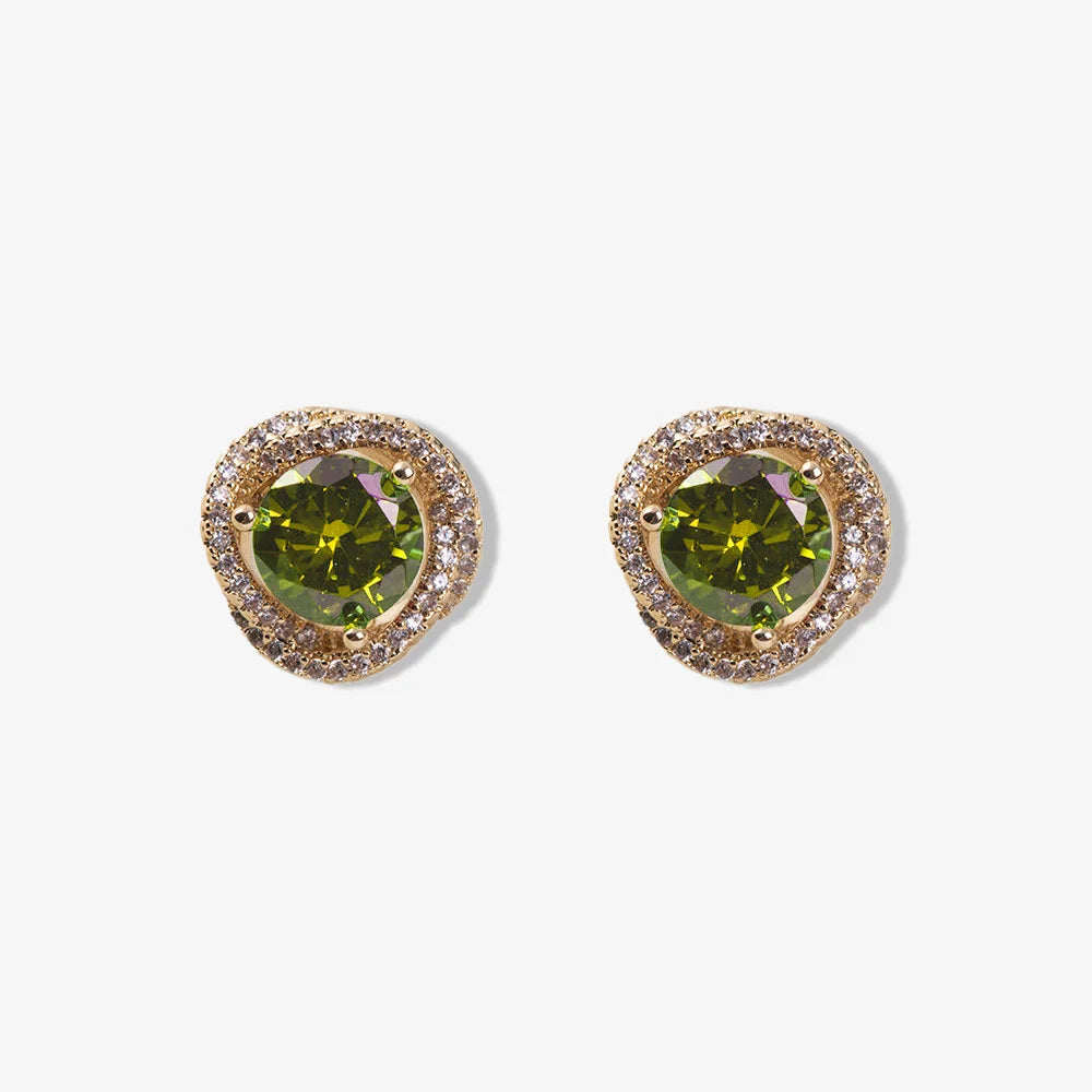 Large emerald zircon clip-on earrings with white zircon accents in 18k gold-plated setting.