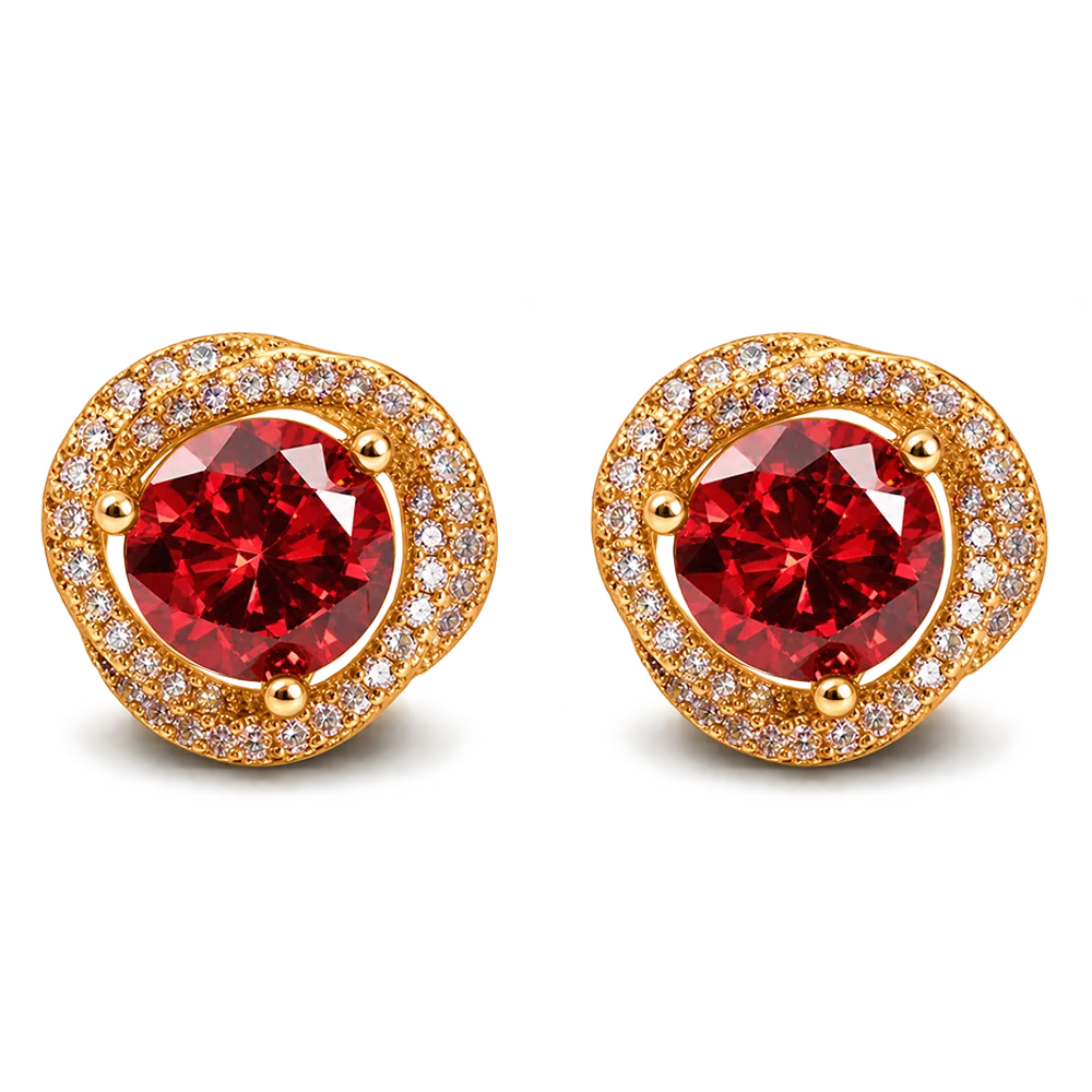 A pair of gold stud earrings featuring a large round red gemstone in the center, surrounded by a halo of small clear stones, on a plain white background.