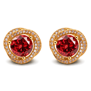 A pair of gold stud earrings featuring a large round red gemstone in the center, surrounded by a halo of small clear stones, on a plain white background.