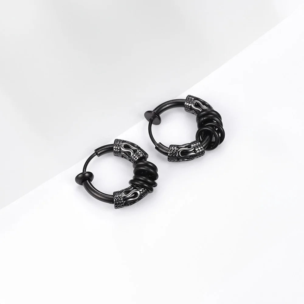 Black Embrace clip-on hoop earrings with decorative dragon head ends, angled view on white background