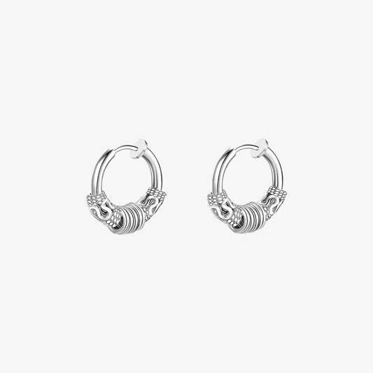 Pair of Embrace Clip-On Hoop Earrings in Silver displaying the detailed pattern.