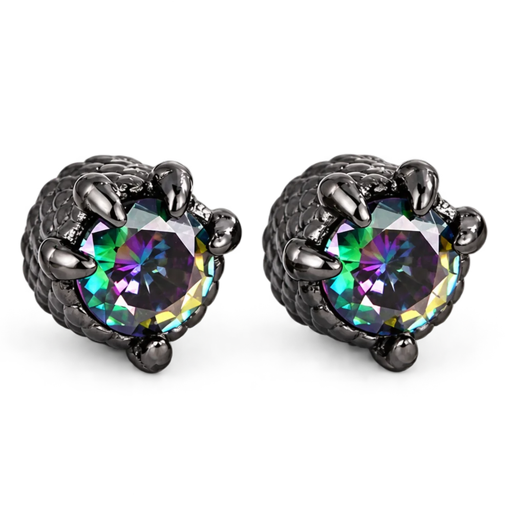 A pair of black claw stud earrings featuring round faceted iridescent gemstones that shift between green, purple, and blue, set in a textured black metal.